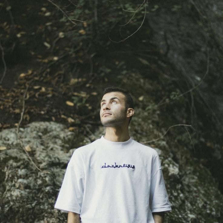 Aisha Kapoor, Lead Design Curator at PlainsHarvestWillow, reviewing corporate floral arrangements